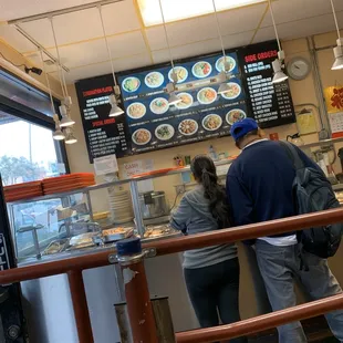 a man and a woman ordering food