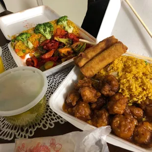 a tray of food and a container of rice