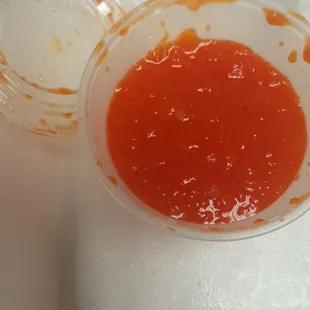a bowl of tomato sauce on a tray