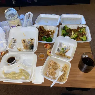 Steamed dumplings, shrimp fried rice, sesame chicken and beef and broccoli.
