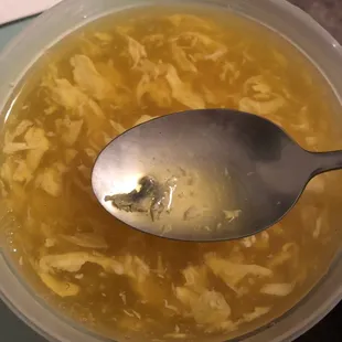 a bowl of soup with a spoon in it