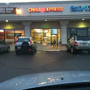 cars parked in front of a chinese restaurant