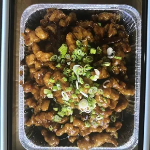 a chicken dish in a plastic container