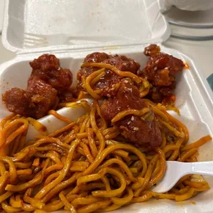 spaghetti and meatballs in a styrofoam container