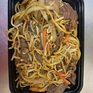 beef and noodles in a black container