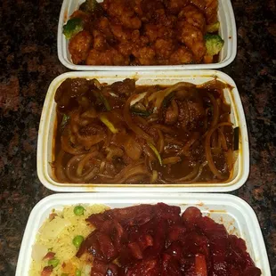 three takeout containers of food