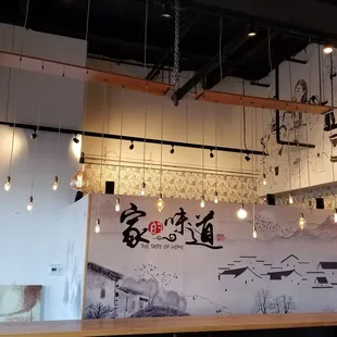a restaurant with a large mural