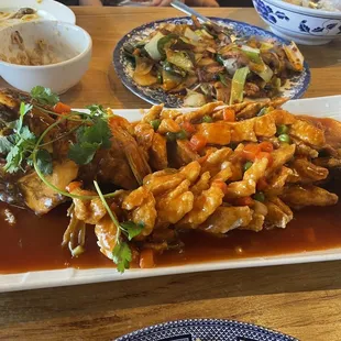 Beautifully prepared whole fish with sauce.