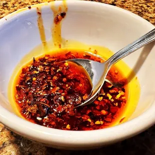 a bowl of chili sauce