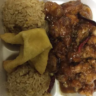 a white styrofoam container filled with rice and meat