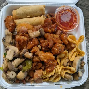 a takeout box of chinese food