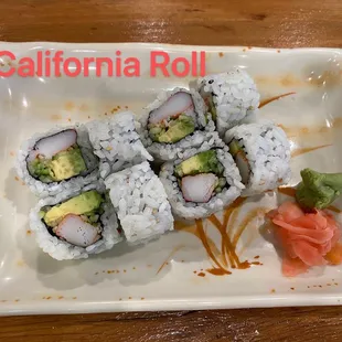 a plate of sushi rolls