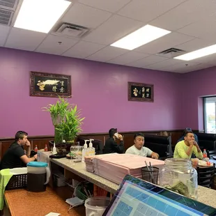 a group of people sitting around a table
