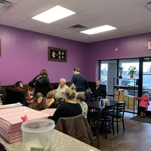 people sitting at tables in a restaurant