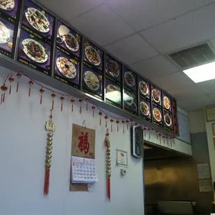 menus on the wall of a restaurant