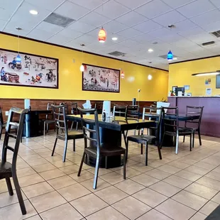 a restaurant with tables and chairs