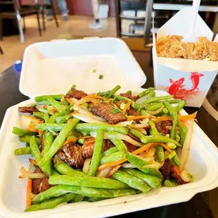a plate of stir fried green beans and carrots