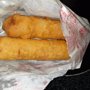 two fried food items in a basket