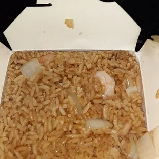a box of rice and onions