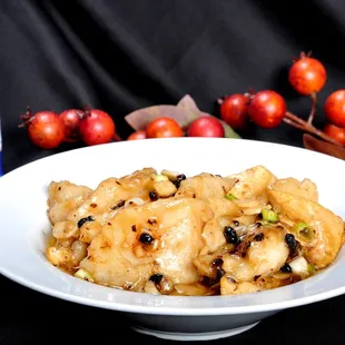 a white bowl of food on a table