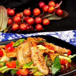 a plate of food with meat and vegetables