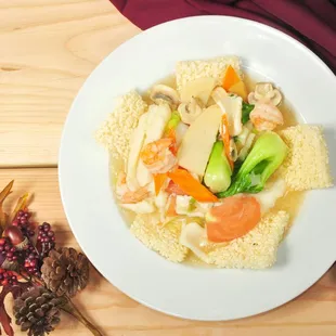 a plate of food on a wooden table