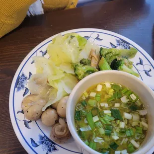 Egg drop soup, mushrooms, cabbage, chicken and broccoli.