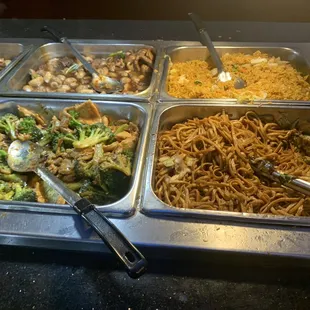 a variety of food in a buffet