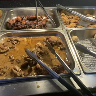 a variety of food items in a buffet