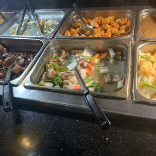 a variety of food items in a buffet