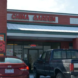 cars parked in front of a chinese restaurant