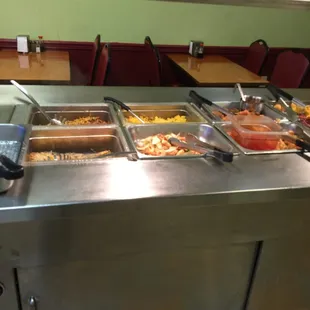 a buffet with a variety of food items