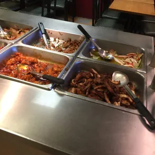 a variety of food items in a buffet