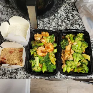 two take out containers of food