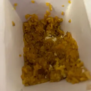 the inside of a paper container with food in it