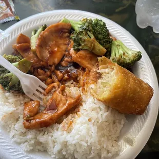 Chicken and broccoli with an egg roll.