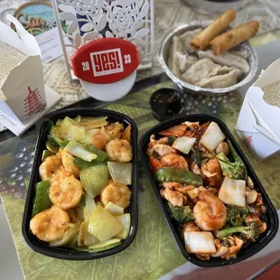 Dinner is served! Shrimp curry and shrimp chicken combo. Dumplings and spring rolls for appetizers.