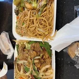 two take out containers of food
