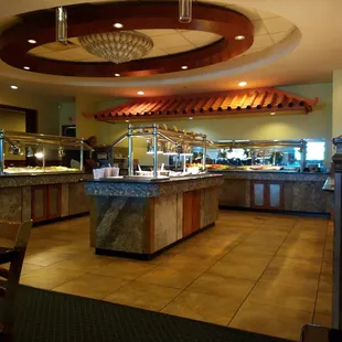 a man standing in front of a buffet