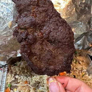 The juicy and gigantic beef on a stick