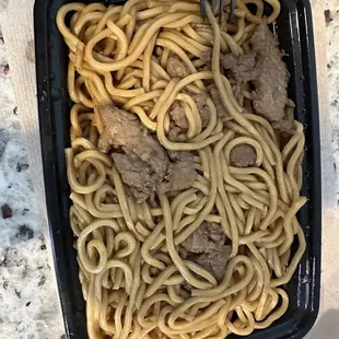a bowl of noodles and meat