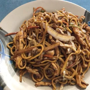 a plate of noodles and mushrooms