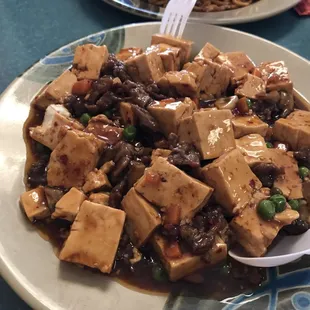 a plate of tofu and beans
