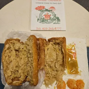 Shrimp Egg Rolls with 3 small ones between the 2 of them.