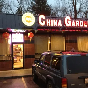 a car parked in front of a chinese restaurant