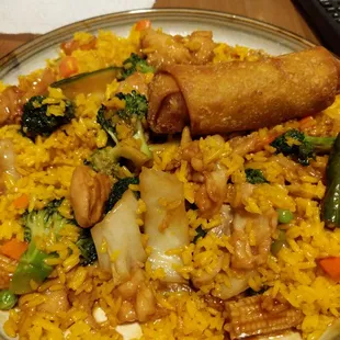 Stir fry veggies and chicken with an egg roll - dinner combo