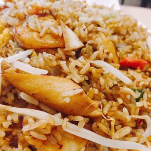 a plate of fried rice and vegetables