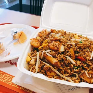 a take out box of food on a table