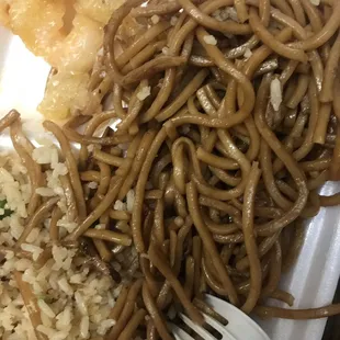 a plate of food with noodles and meat