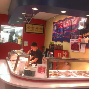 a man preparing food in a restaurant